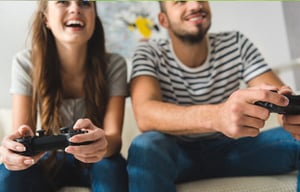 Happy couple playing a video game together