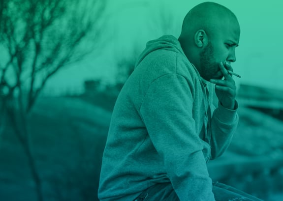 middle aged man smoking a cigarette